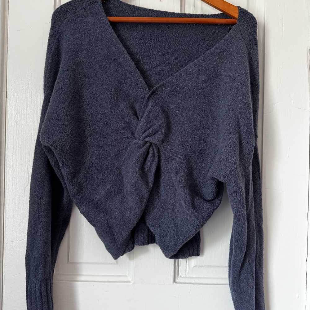 Blue V-Neck Sweater with Modern Twist waist